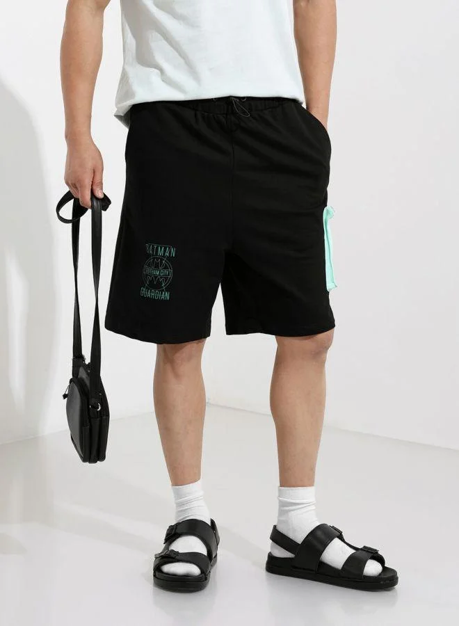 ذا انديان كراج كو Men Oversized Fit Batman Printed Side Pocket Mid-Rise Shorts